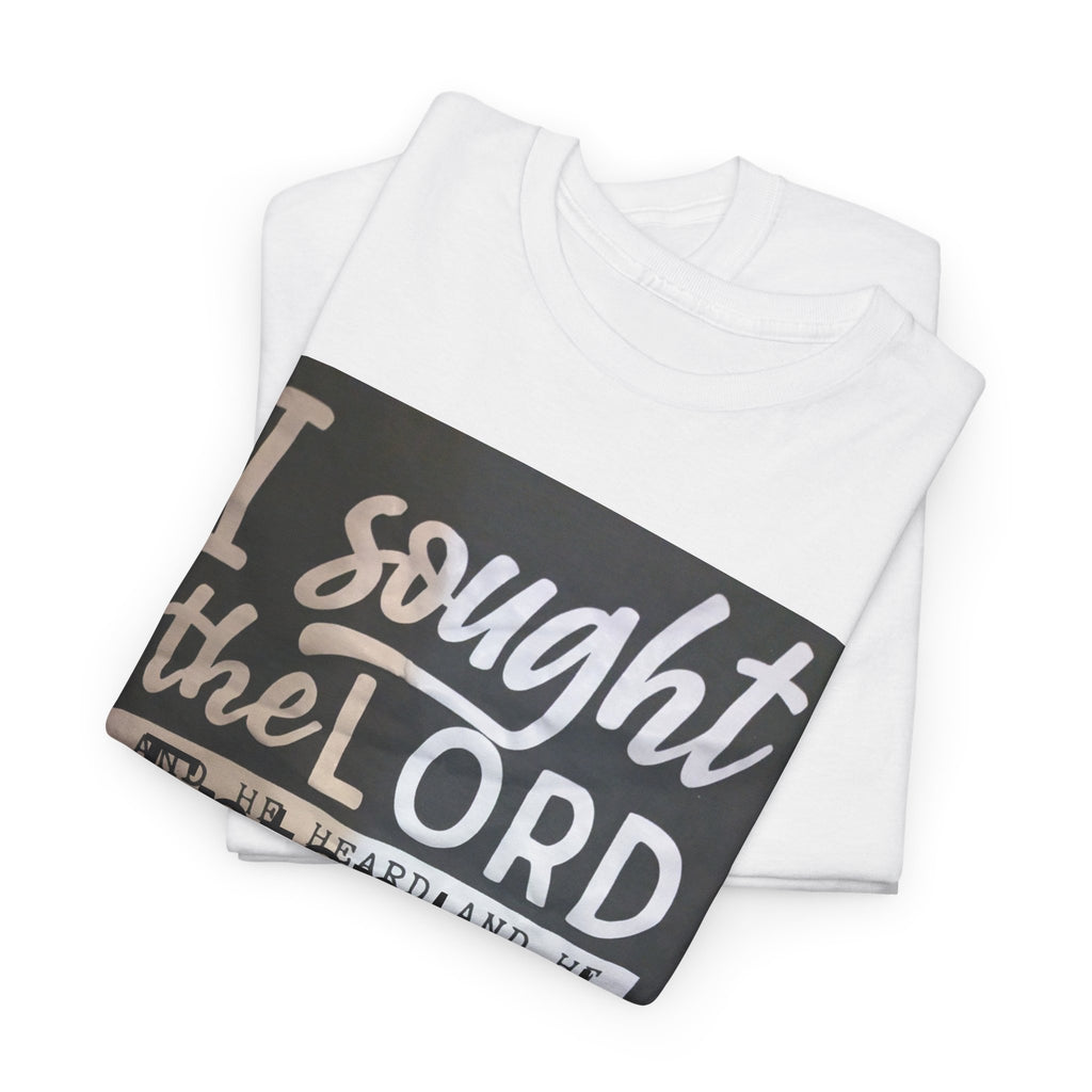 A folded white t-shirt with a black graphic print on the front that reads 'I sought the LORD' in white lettering, displayed on a clean white background.