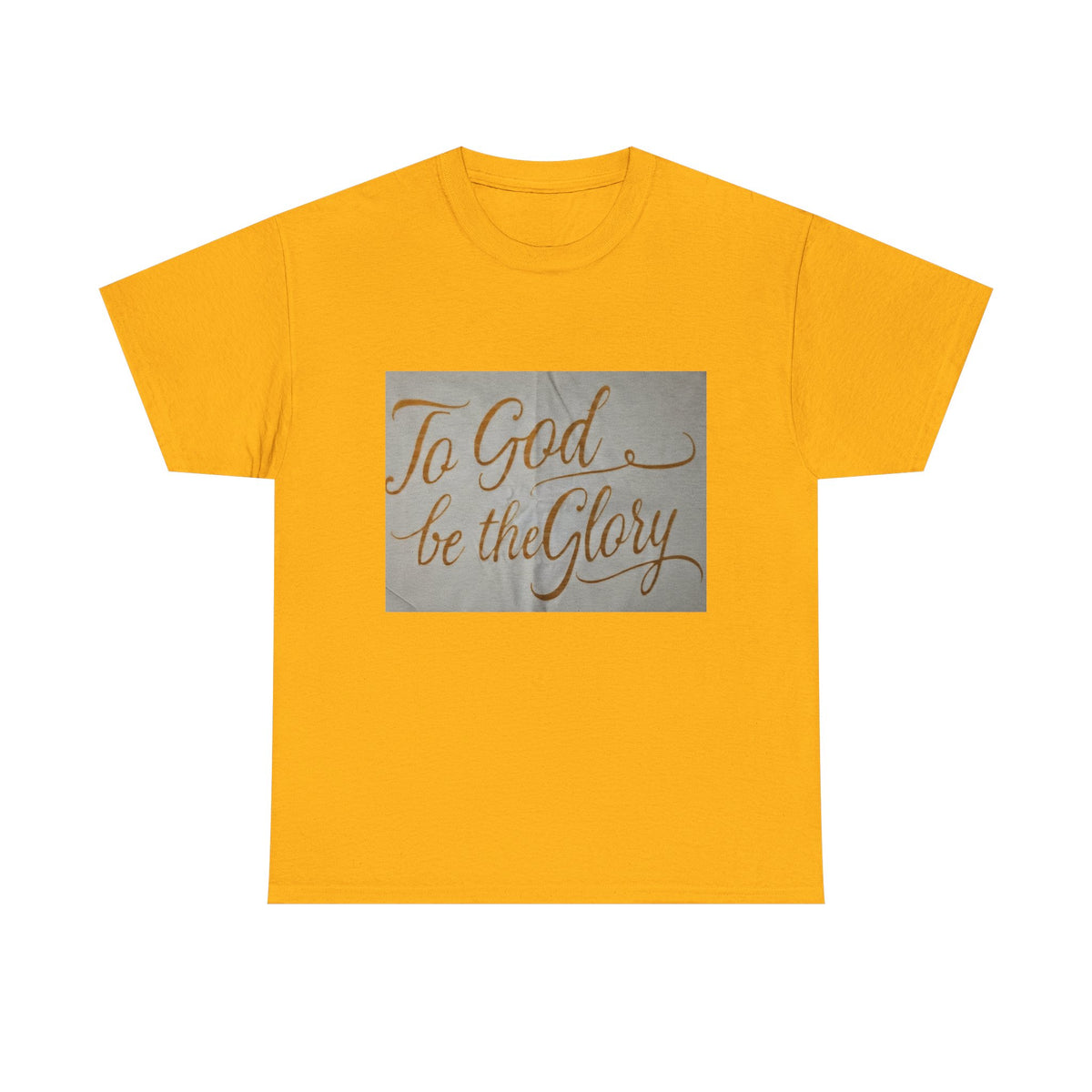 A yellow short-sleeve t-shirt with a rectangular gray graphic on the chest featuring the phrase 'To God be the Glory' in brown cursive script, displayed on a solid white background.
